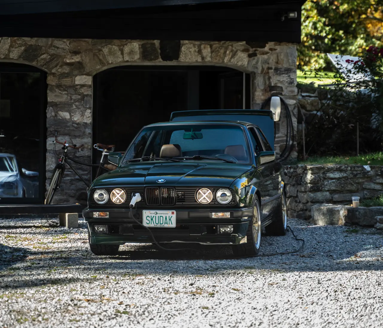 Skudak BMW E30 charging at the workshop